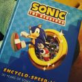 Sonic the Hedgehog Encyclo-speed-ia is an encyclopedia and art book about the Sonic . It was released in December 2021 as part of the series' 30th anniversary celebration and is written by Archie/IDW Sonic comic writer Ian Flynn.
